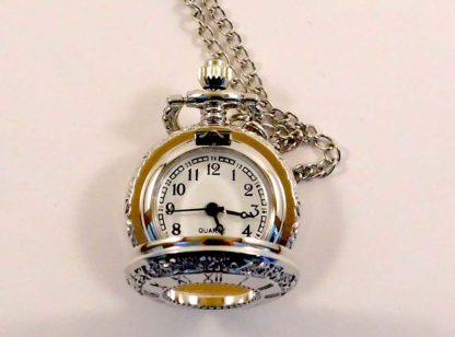 An open view of the small silver fob watch showing the silver chain