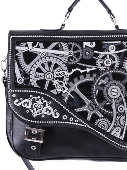 A close up of the messenger bag showing the black, white and grey cog details