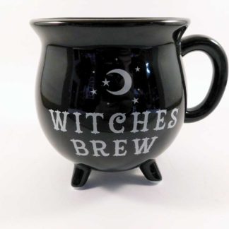 A black cauldron shaped mug with three little feet, a handle and the words witches brew in silver - it also has a crescent moon surrounded by stars above the lettering