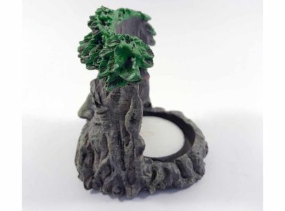 Side view - the greenman face extends back in a circular fashion making a receptacle for a tealight candle