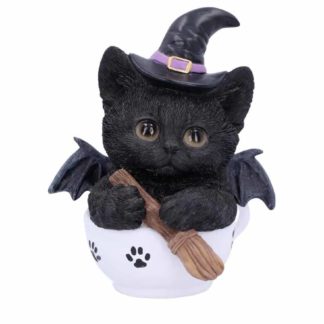 A cute witchy kitten holding a broom with a witches hat in a white teacup