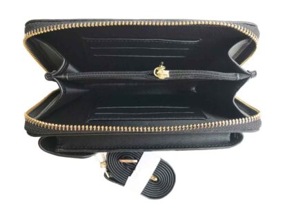The black purse section zippers open with a gold zipper. Inside there is a zippered coin section, 6 card slots and spaces for notes and receipts
