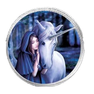 The central image of this round, silver coin purse is a woman in a blue cloak cuddling in with a white unicorn - the backdrop is a blueish woodland scene