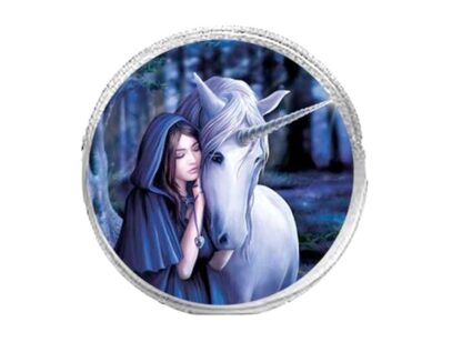 The central image of this round, silver coin purse is a woman in a blue cloak cuddling in with a white unicorn - the backdrop is a blueish woodland scene