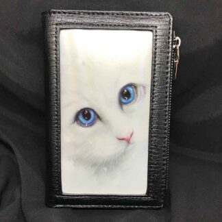The front panel features a snowy white cat with piercing blue eyes gazing at the viewer