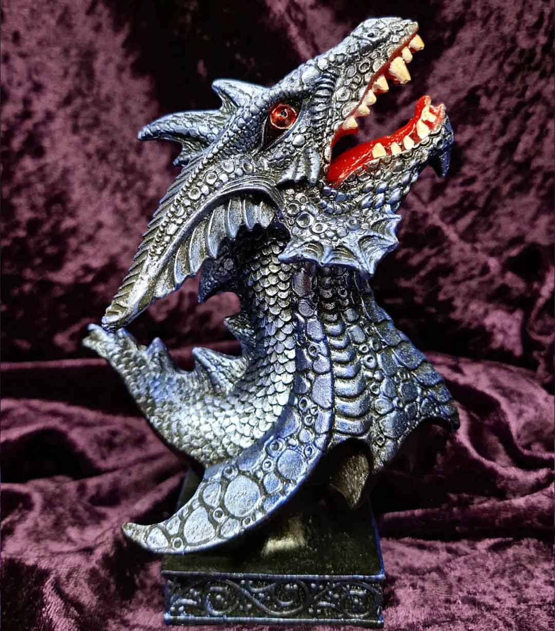 A blue dragon bust, roaring at the sky