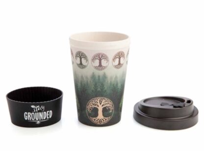 The eco mug split into the three parts, silicon grip, bamboo mug and black lid